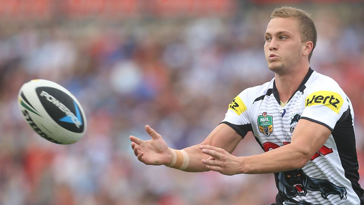 SYDNEY, AUSTRALIA - MARCH 22: Matthew Moylan of the Panthers passes the ball during the round three NRL match between the Penrith Panthers and the Canterbury-Bankstown Bulldogs at Sportingbet Stadium on March 22, 2014 in Sydney, Australia. (Photo by Mark Metcalfe/Getty Images)
