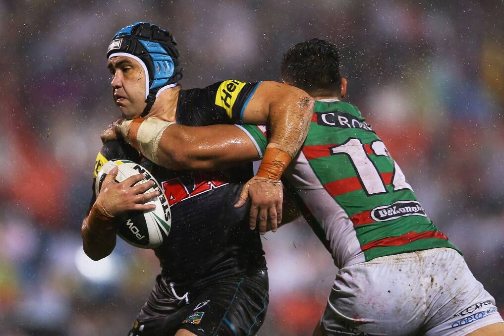 SYDNEY, AUSTRALIA - APRIL 11: Jamie Soward of the Panthers is tackled by Ben Te'o of the Rabbitohs during the round 6 NRL match between the Penrith Panthers and the South Sydney Rabbitohs at Sportingbet Stadium on April 11, 2014 in Sydney, Australia. (Photo by Brendon Thorne/Getty Images)