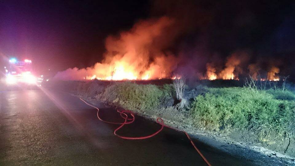 Firefighters rush to a blaze on the Lowlands, Monday evening.