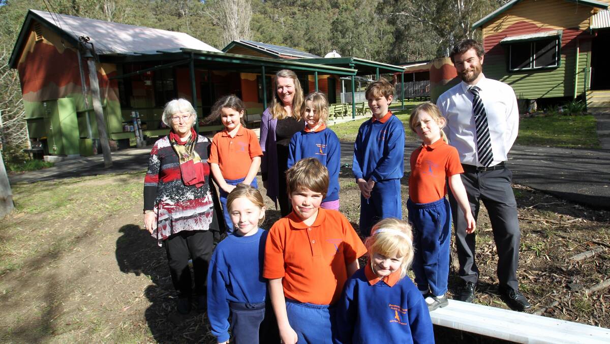 Calling the roll is a fast task:  From left, teachers Suzie Startin and Louky Gibb and relieving principal Robert Hawkes with seven of Macdonald Valley Public School’s nine pupils.  Picture: Gene Ramirez