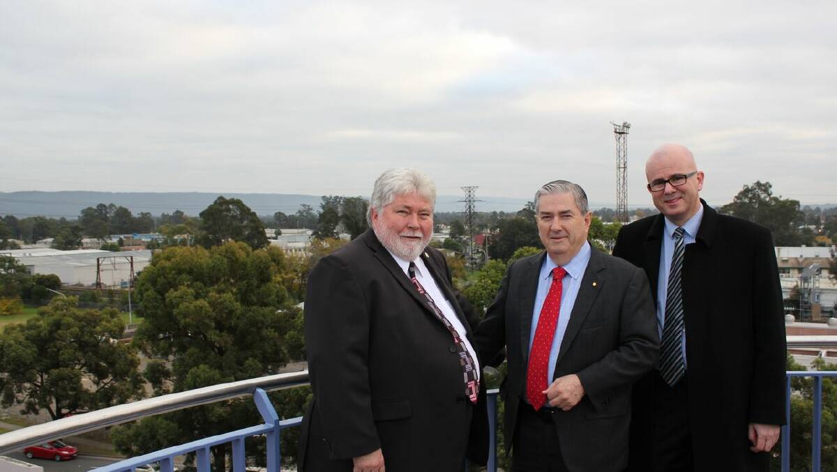 Working together from great heights: Hawkesbury Mayor Kim Ford, left, with  Penrith Mayor Ross Fowler, centre, and Blue Mountains' Mayor Mark Greenhill, looking over their respective local government areas.