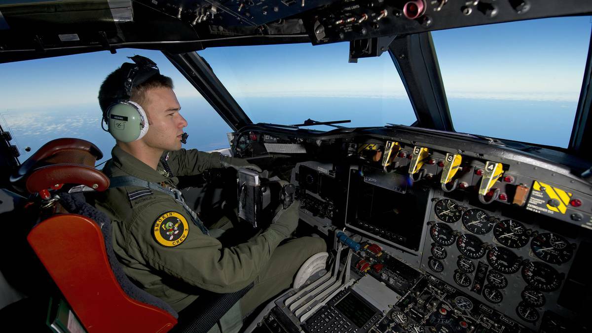 Royal Australian Air Force (RAAF) pilot, Flight Lieutenant Russell Adams from 10 Squadron, steers his AP-3C Orion over the Southern Indian Ocean during the search for missing Malaysian Airlines flight MH370 in this picture released by the Australian Defence Force March 20, 2014. Photo: Supplied.