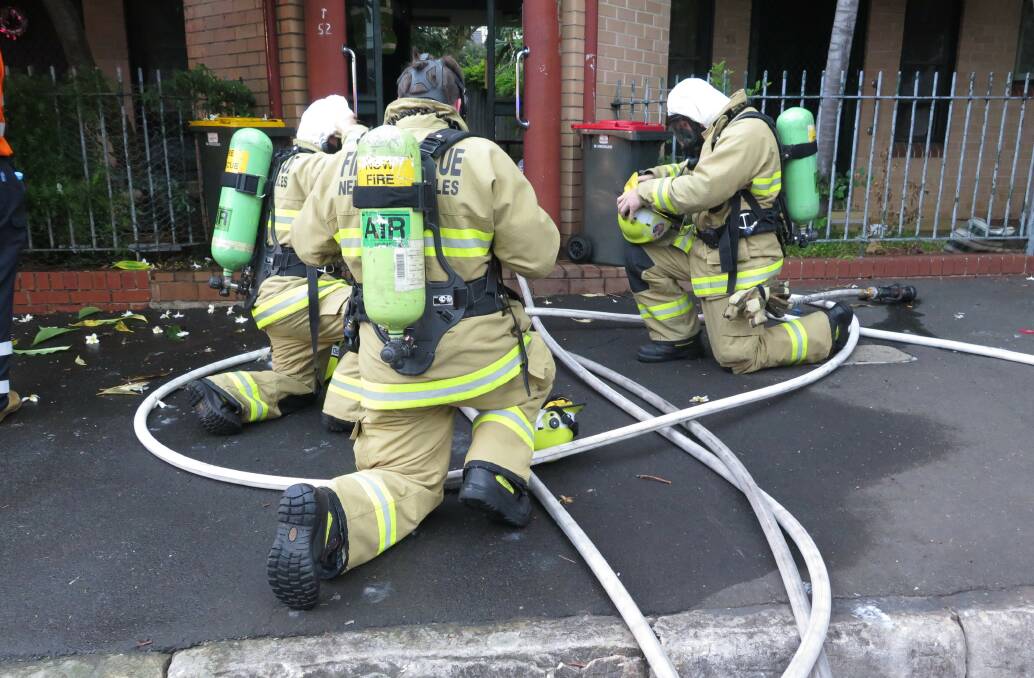 Firefighters wearing special equipment including masks to manage carbon monoxide environments. Use equipment to test for the gas in the air. Picture: Supplied