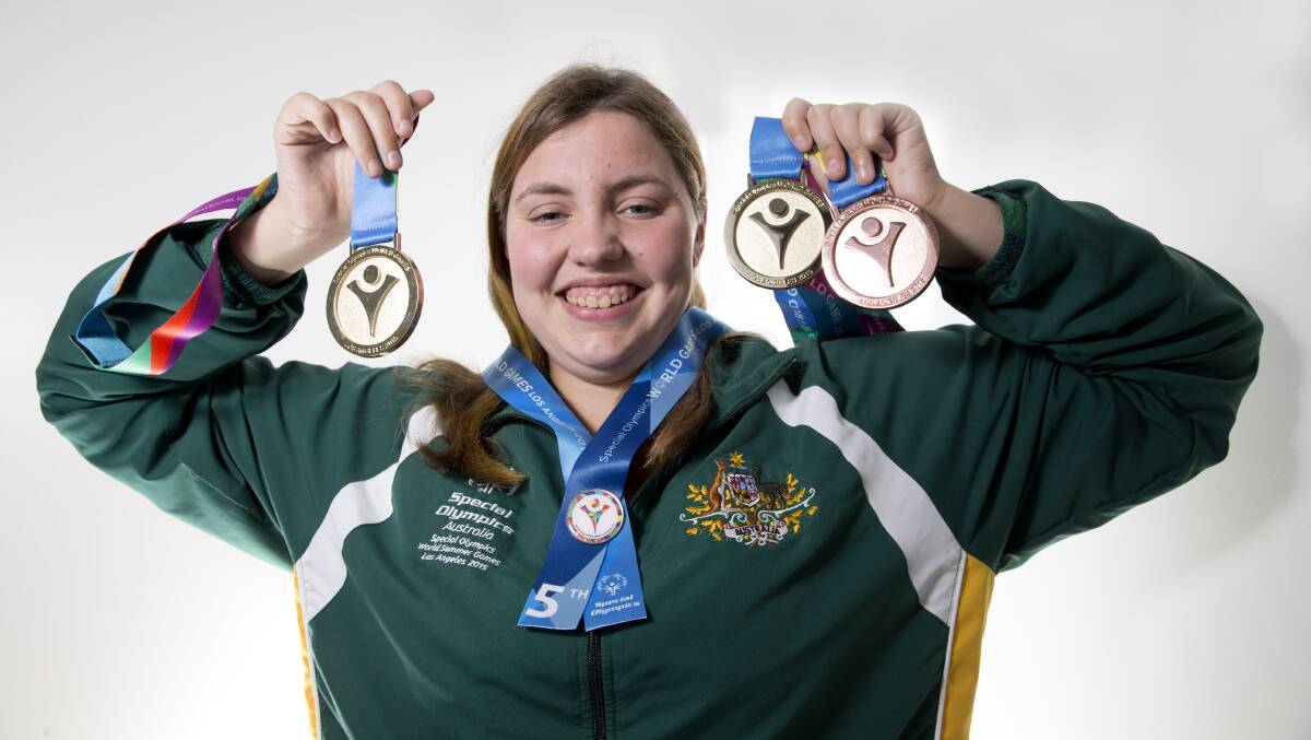 Sandy Freeman proudly displays the medals she won at the Special Olympics World Games in Los Angeles recently, where she broke two world records. Picture: Geoff Jones