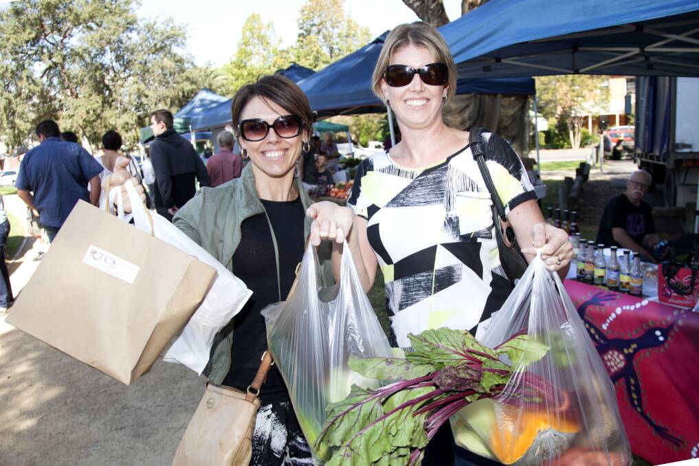 Leonie Green and Raema Melverton with their bags of goodies. Picture: Geoff Jones