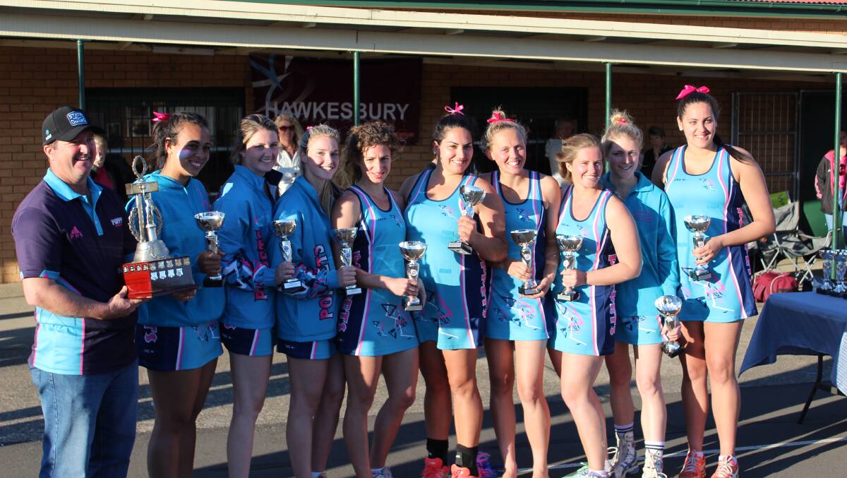 From left, Poppets coach Craig Sullivan, with players Sarafina Taufa, Ashley Sullivan, Brooke Sullivan, Chantelle Portelli, Charmaine Dimech, Jamie Brennan, Kelsey Sullivan, Kaitlyn Griffin and Tegan Ryan celebrate winning the A1 Hawkesbury City Netball Association grand final at the weekend. Picture: Conor Hickey