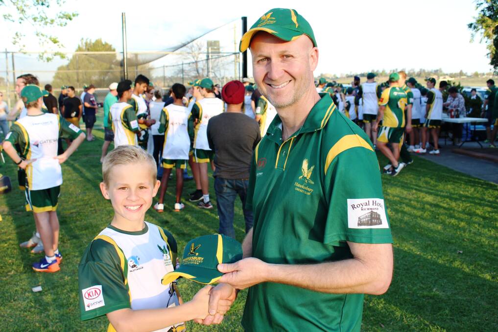Max Laing received his first Hawkesbury Cricket Club cap from his father Dean, a life member of the club. Picture: Conor Hickey