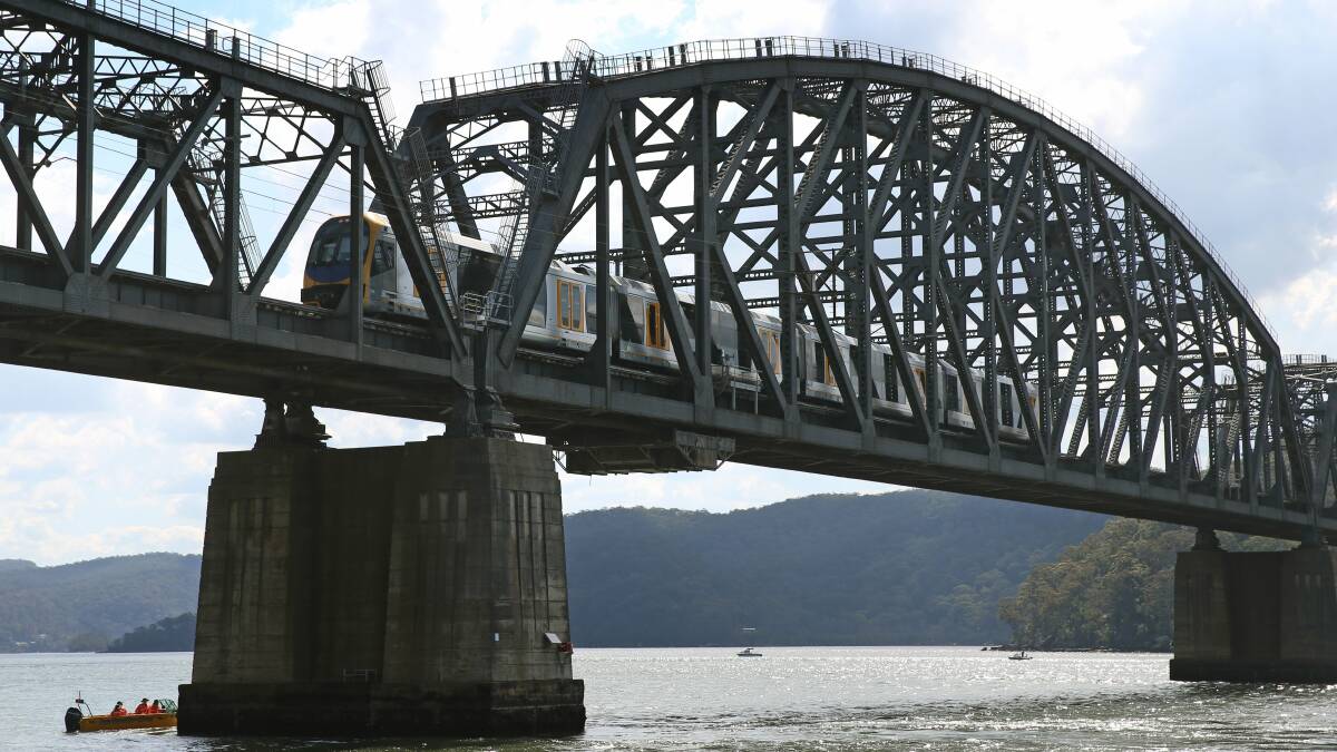 A passenger train crosses the Hawkesbury river at Brooklyn. Picture: Marina Neil