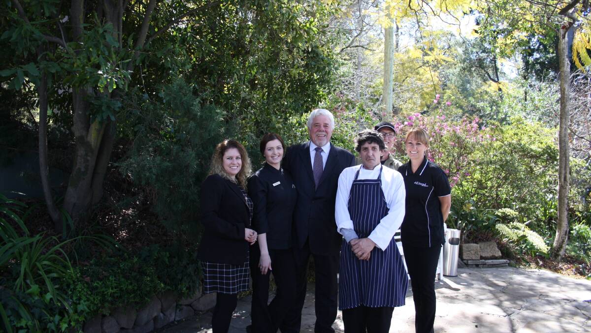 Paul Maher (centre), proprietor of Loxley on Bellbird Hill. He’s pictured with some of his staff.