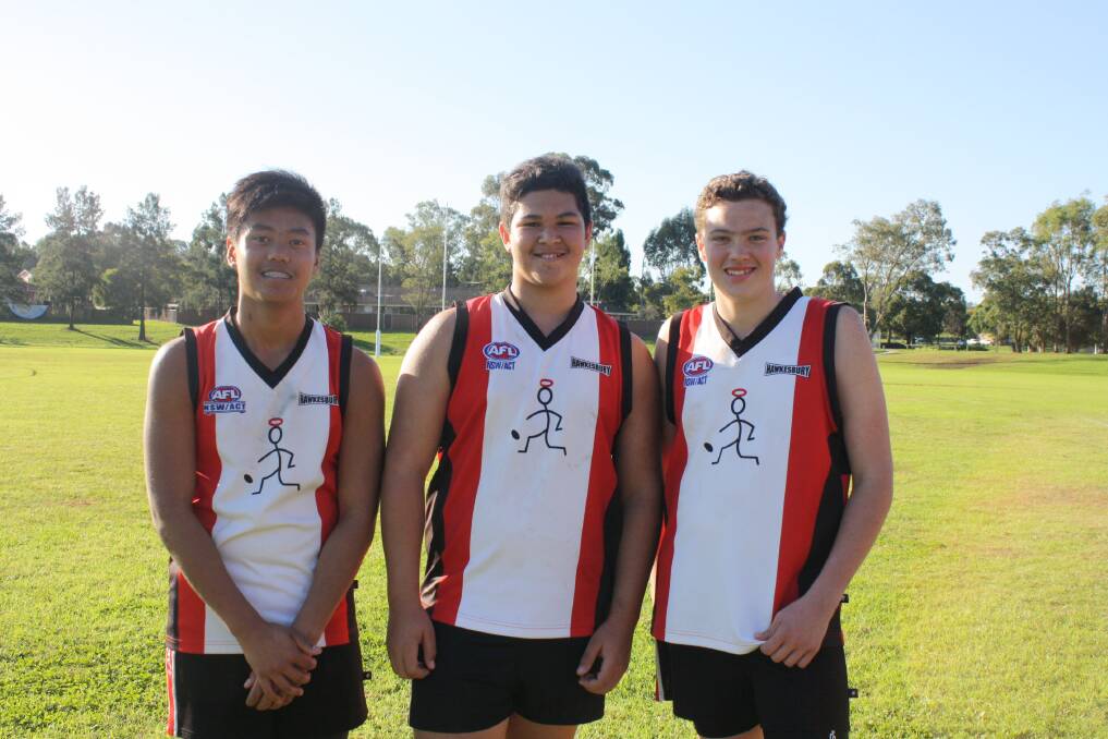 Ekkarad Bumrungsil, left, Xander Kennedy and Luke Hodges in their Hawkesbury Saints gear. Picture: Supplied