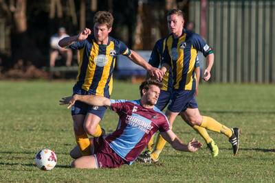 Stumbles: Hawkesbury City player Rhys Alchin in action for the club. The club lost 4-3 in a penalty shoot-out to the Western NSW Mariners on Wednesday night. Picture: Geoff Jones