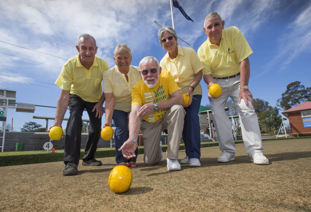 Windsor Bowling and Sports Club members Mark Ashton, Jenny Neels, Neil Cant, Val Cant and David Gosden don yellow to support Daffodil Day and raise money for cancer research. Picture: Geoff Jones