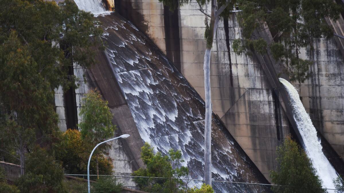 Water flows over the Warragamba Dam spillway which is expected to cause minor flooding along the Hawkesbury River. Picture: Nick Moir, 27 August 2015