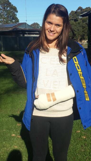 Jess Gardiner and her broken wrist in a cast.