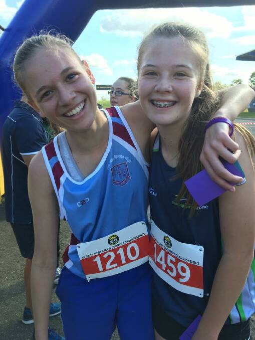ALL HEART: Hawkesbury High School student Ashley Barter (left) and the injured student she helped cross the finish line at the Sydney West Zone Cross Country carnival this week. Picture: Facebook.