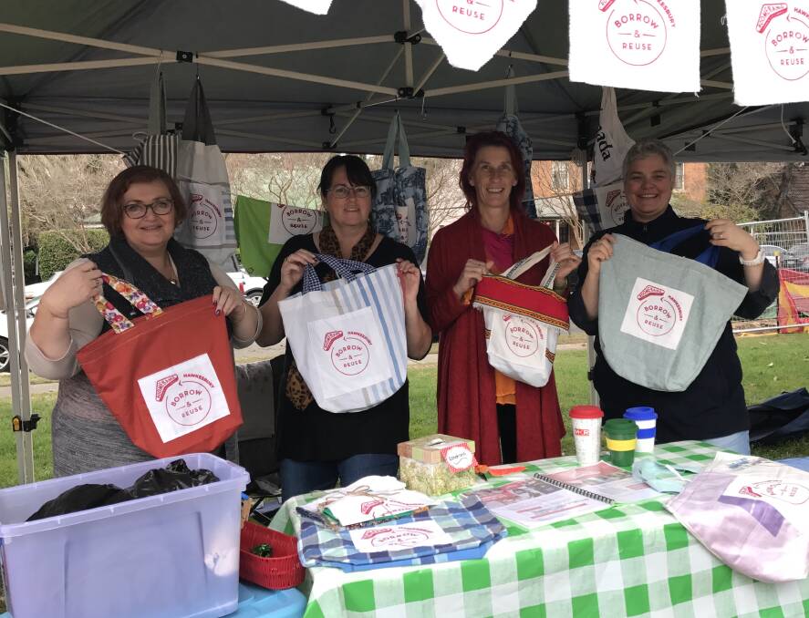 PLASTIC FREE: Volunteers for the Hawkesbury Boomerang Project at the Richmond Good Food Market recently. Boomerang Bags is a grassroots, community driven movement tackling plastic pollution Picture: Supplied.