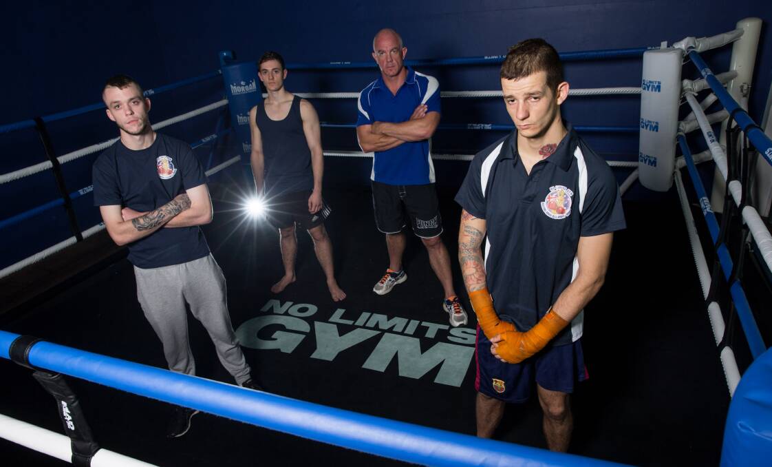 READY TO FIGHT: No Limits Richmond fighters Matty Jackett, Dylan Bowen and Adriano Schettini with trainer Jason Naylor. Picture: Geoff Jones.