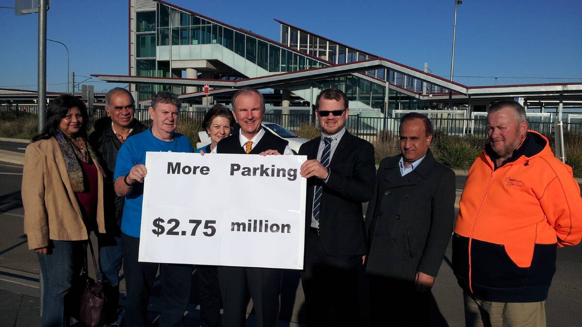 MORE PARKING: Member for Riverstone Kevin Conolly with local residents in front of Schofields Station