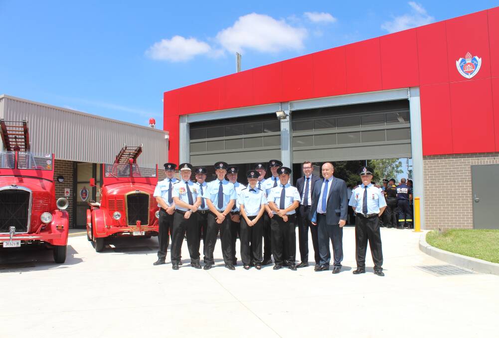 OFFICIALLY OPEN: Minister David Elliott and Fire Commissioner Greg Mullins with the Windsor NSWFR crew at the new station.
