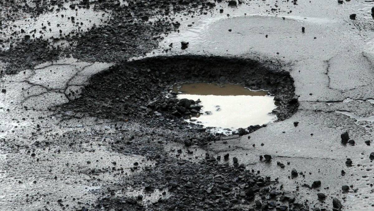 File pic of a pot hole. Picture: Leanne Pickett