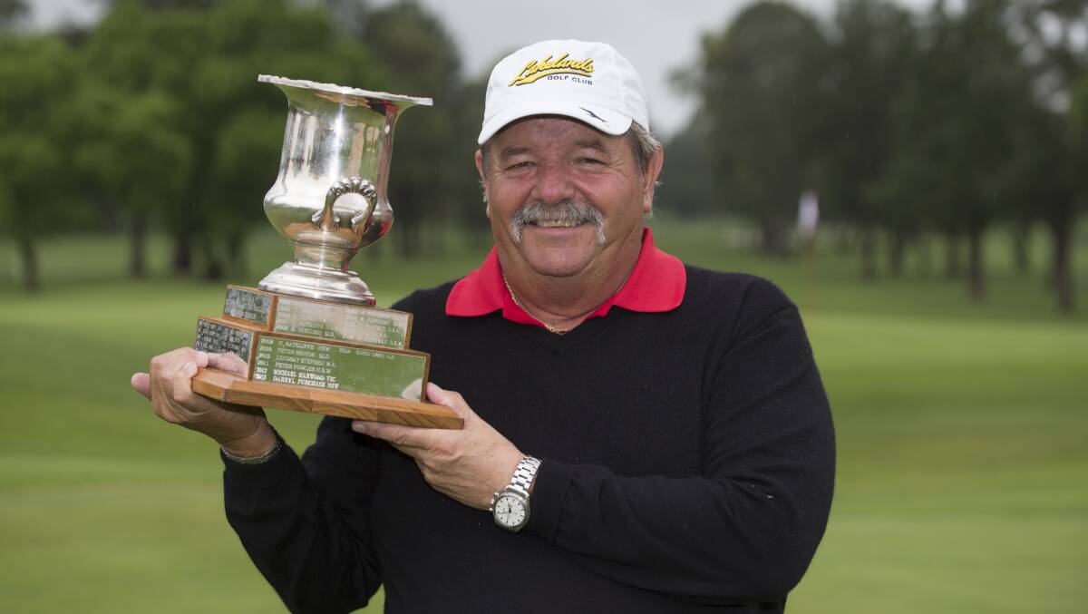 CHAMPION: Rodger Davis proudly displays his Australian PGA Senior Championship trophy at Richmond. Picture: Geoff Jones
