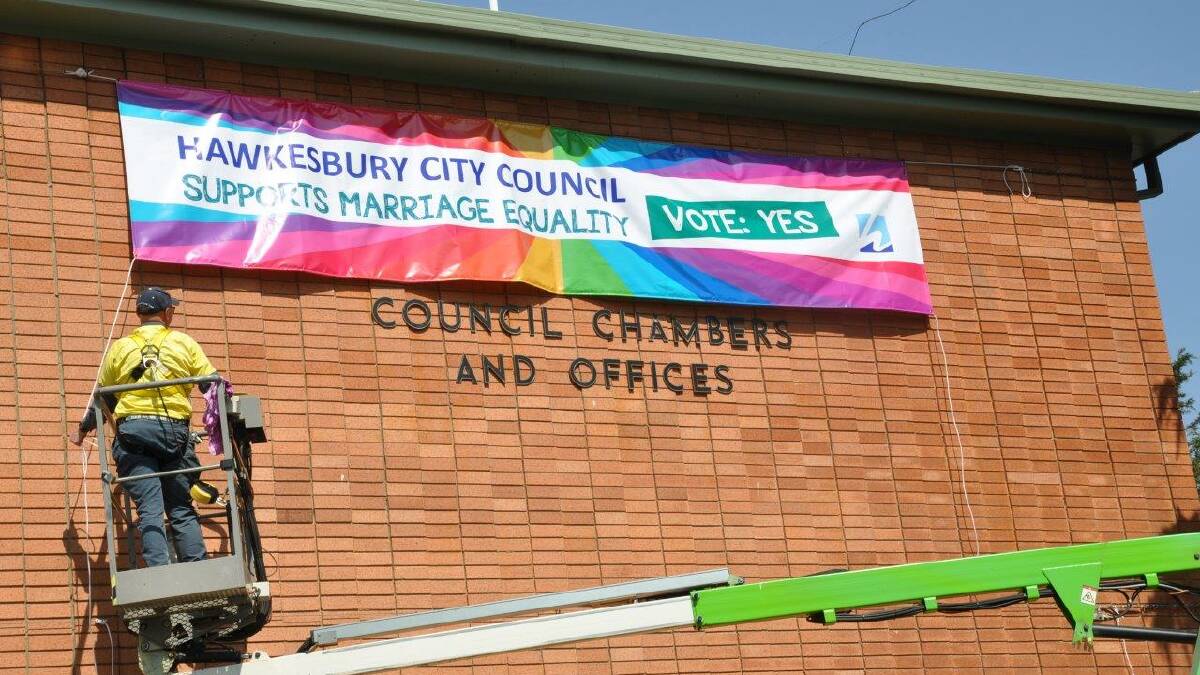 The Hawkesbury Council banner promoting same-sex marriage is replaced at a higher location thanks to the aid of a cherry picker. Picture: Supplied