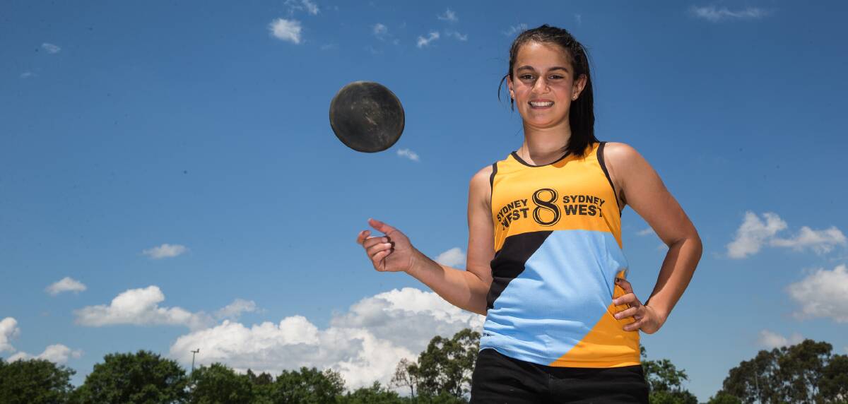 FINESSE: Georgia Portelli tosses a discus, but not nearly as far as she will at the Australian All Schools Athletics Championships. Picture: Geoff Jones