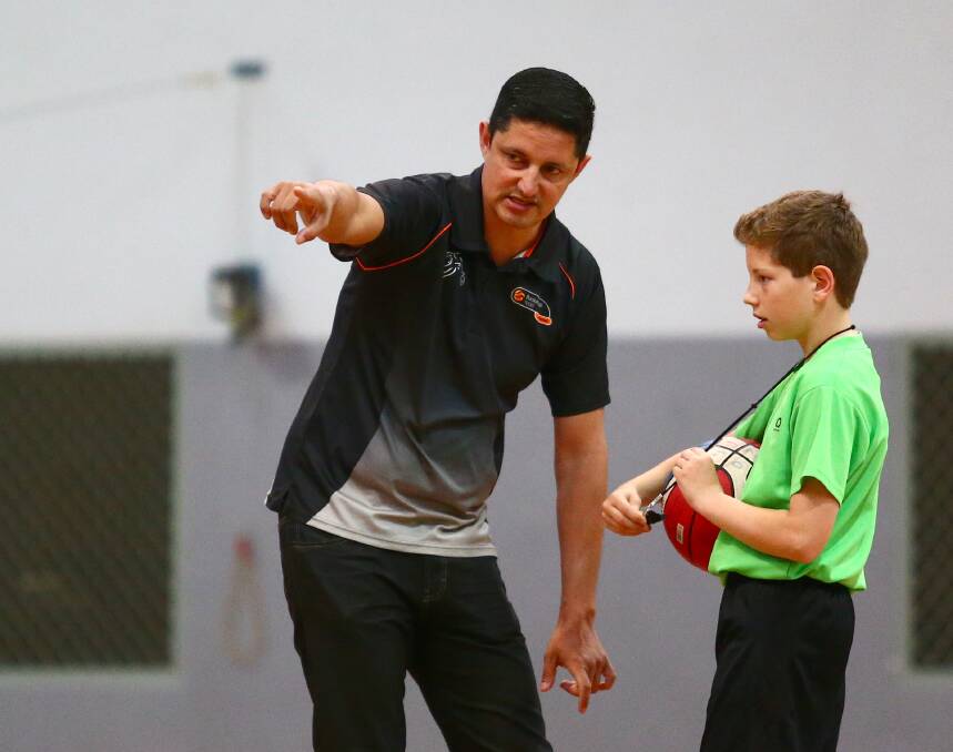 MENTOR: New referees development manager Nick Varlet shows a young Hawkesbury basketball referee the ropes. Picture: Geoff Jones