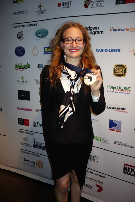 Louise Azzopardi proudly displays her gold medal for heavy vehicle mechanics. Picture: Supplied
