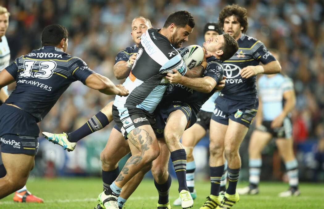 BRAVE: Lachlan Coote puts his body in front of a charging Andrew Fifita during the preliminary final. Picture: Getty Images