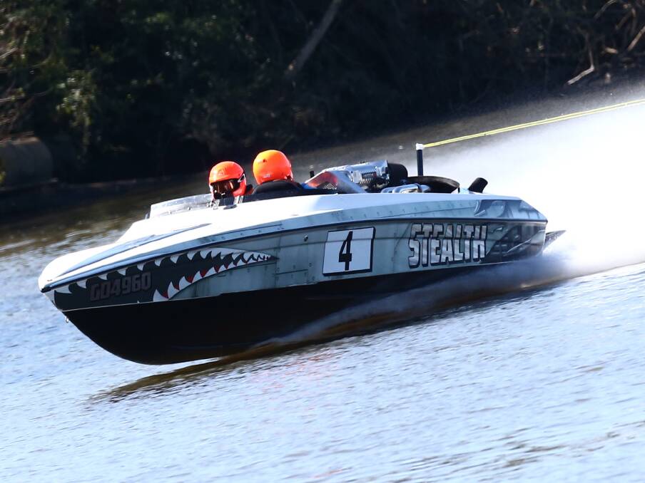 QUICK BUT NOT QUIET: Stealth pulls skiers Codie Rigg and Steven Berry along in the Hawkesbury 120. Picture: Geoff Jones