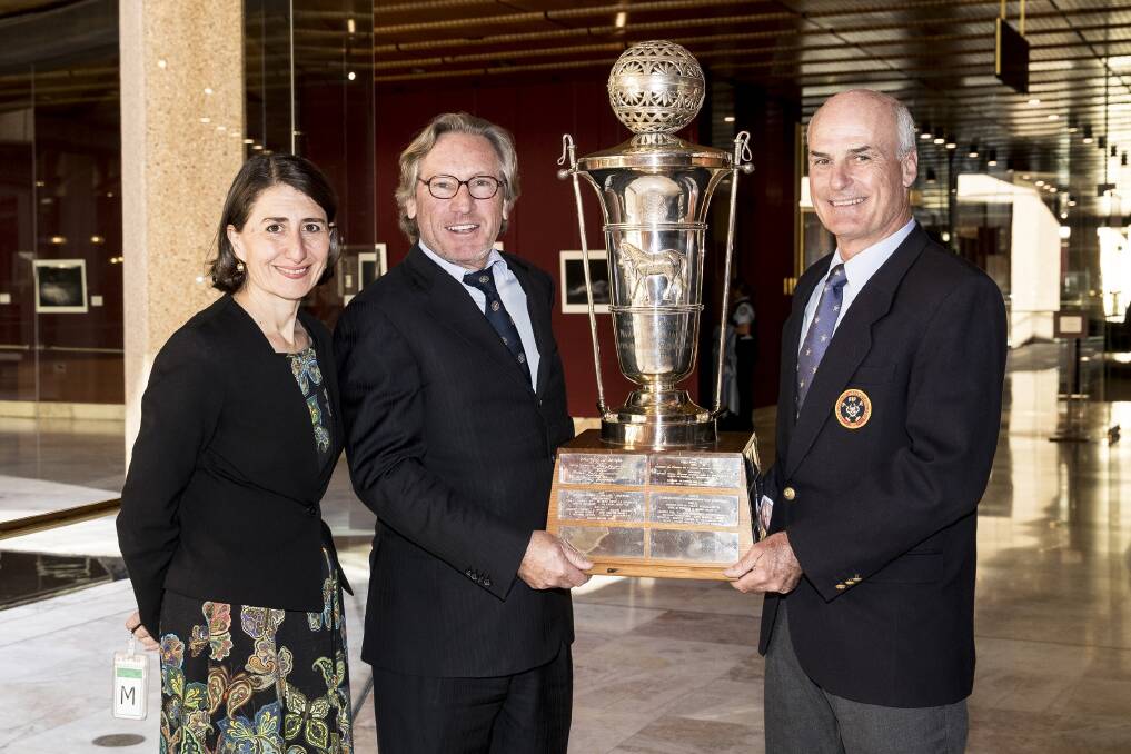 The World Polo Championship trophy is held by Peter Higgins and Alejandro Taylor, with NSW Premier Gladys Berejiklian. Picture: Supplied