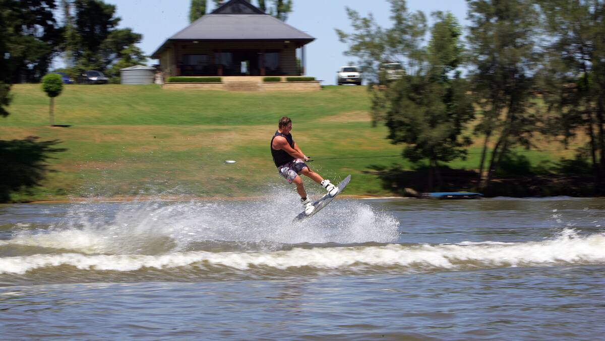 Josh Ellison wake-boarding on the Hawkesbury River. Picture: Jeff Darmanin
