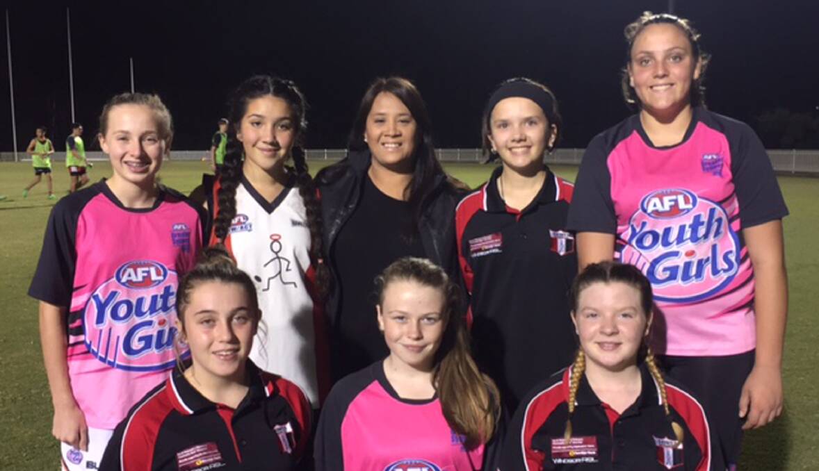 CHUFFED: Hawkesbury Saints players from the under-15 girls team with coach Simonne Kennedy at a western Sydney girls football team trials session.