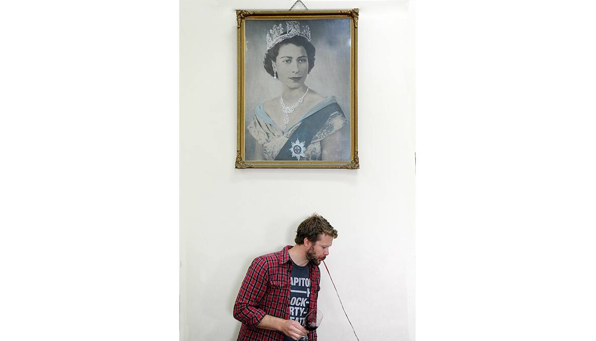 Grant Nowell's photo of Peter Dredge tasting wine as the Queen looks on has drawn strong criticism.