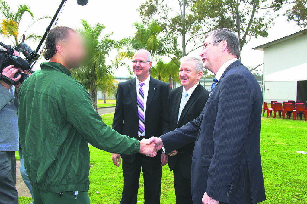 NSW Commissioner Peter Severin, NSW Drug Court judge Roger Dive and NSW Attorney General Greg Smith chat with an inmate at John Morony Correctional Centre.