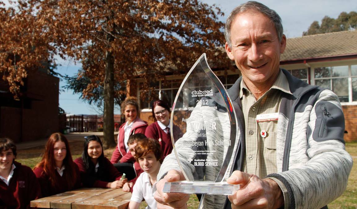 Soon after Ian's 300th blood donation, he rallied with Queanbeyan High School students to take out the 2012 Vampire Shield. Picture supplied 