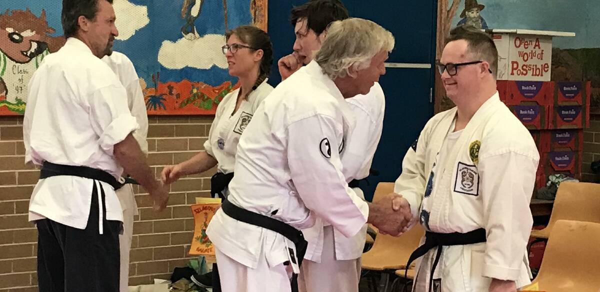 Proud: Louis being awarded his black-belt at Freemans Reach Public on Saturday, November 23. Picture: Supplied.