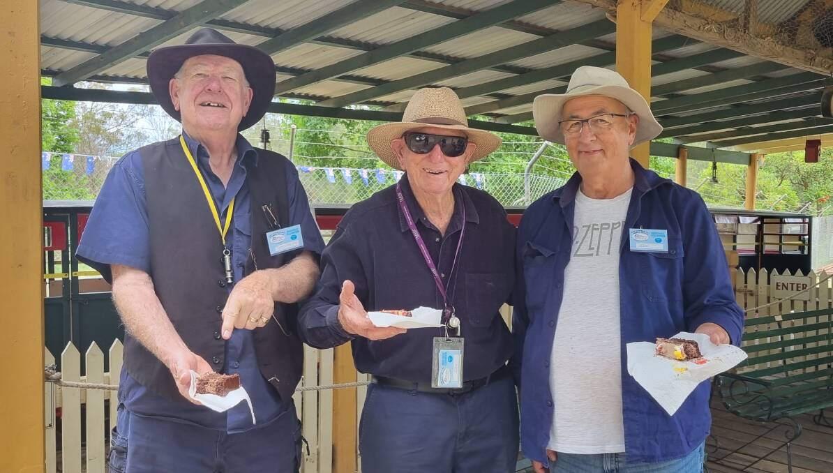 The Australiana Pioneer Village volunteer train drivers and guards enjoying some birthday cake at the village's 52nd anniversary celebrations. Picture supplied.
