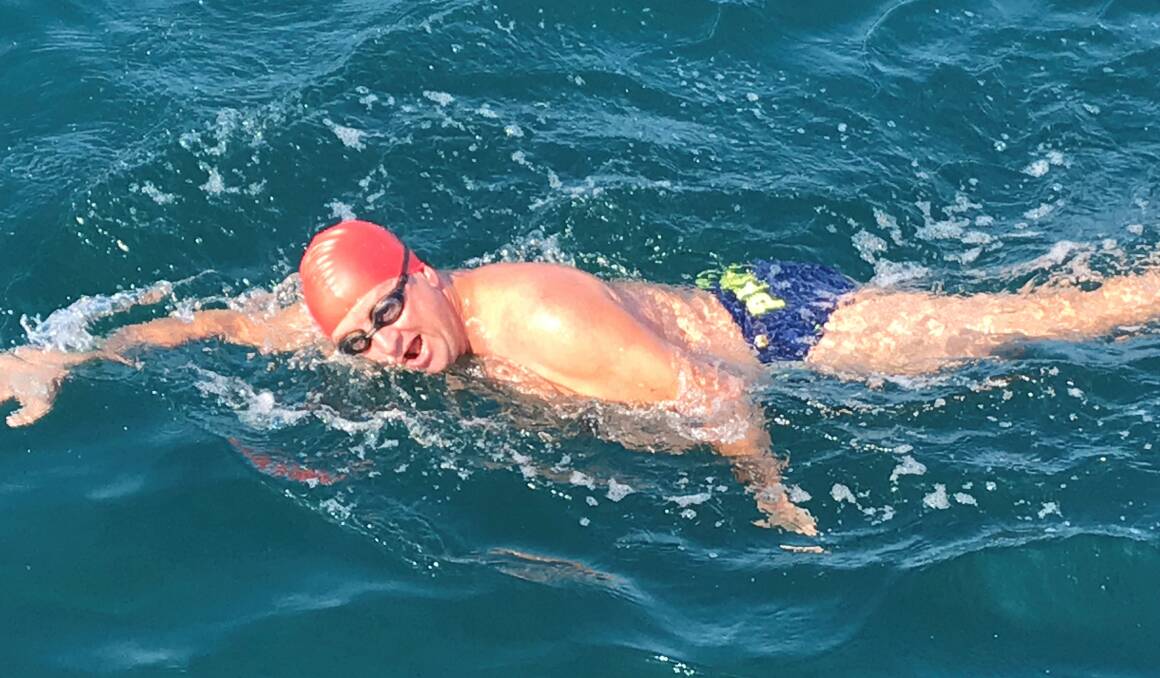 In the water: Geoff Evans joined his friends Steve and Michael Payne on their journey to England to swim the English Channel. Picture: Supplied 