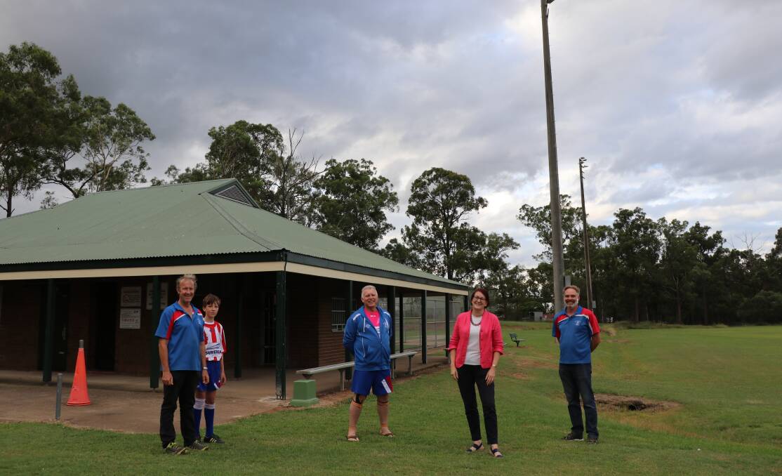 Macquarie MP Susan Templeman with Wilberforce United Soccer Club members, from left to right, Don Culey, Daniel Davey, Boris Racki and Adam Jones, with the new lights in the background (Archive picture).