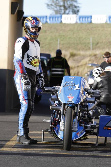 Focused: Adam stands next to his bike and remains focused on the task at hand. Picture: John Baremans