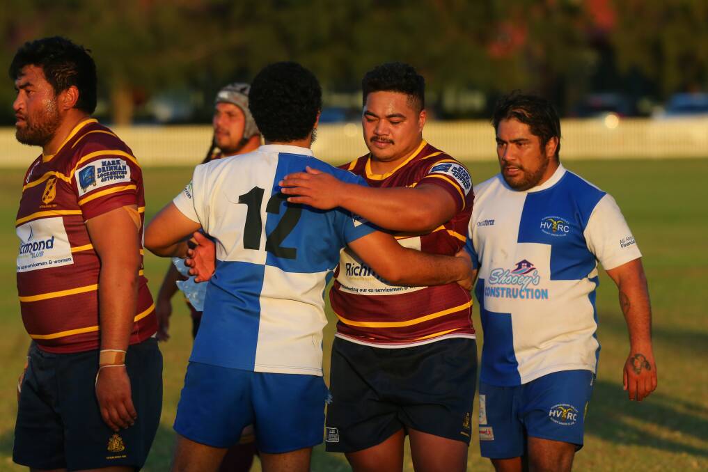 Local derby: Hawkesbury Ag College and Hawkesbury Valley players shake hands after their First Grade match on Saturday, April 27. Picture: Geoff Jones.