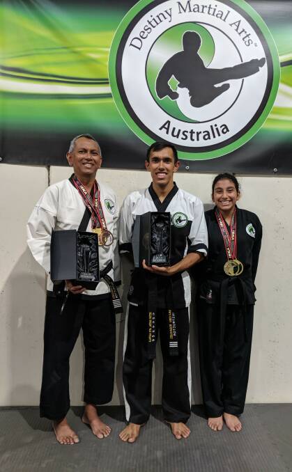 The team: Master Clarence Rodrigues, instructor Brayden Rodrigues and Elizabeth Zouait with their awards. Picture: Supplied.