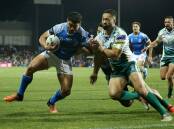 Battle: Samoa's David Nofoaluma fights for the corner against the Cook Islands in the two sides test match, on Saturday night at Campbelltown Sports Stadium. Picture: NRL Photos.
