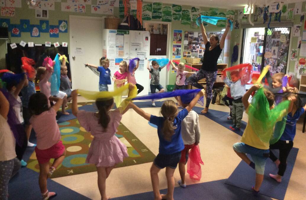 Learning young: Elaine Henry runs a kids yoga class that is tailored to their age, including props and music. Picture: Supplied.