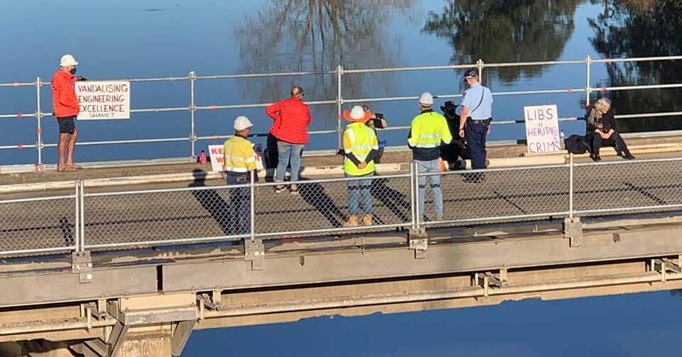 Members of community groups in support of maintaining the old Windsor Bridge have locked themselves on the structure throughout the past week. Picture: Supplied.