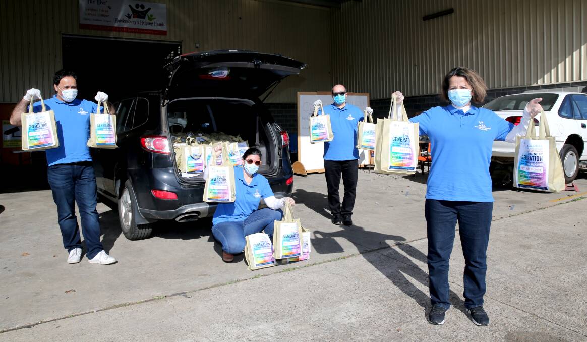 MTO members Hamid, Pegah, Arman and Freshta prepare to hand out MTO donated toiletries at Helping Hands Hawkesbury. Picture: Geoff Jones