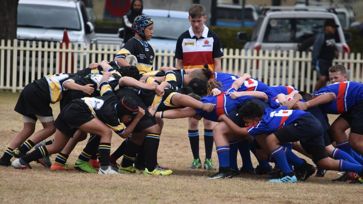 Fighting: Sydney West (black) in a scrum during their third place playoff against Sydney East on the final day of competition. Picture: Tracy McKinniery 