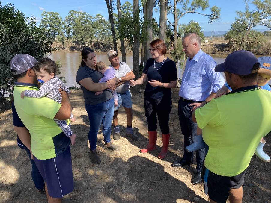 Assessing the damage: Opposition Leader Anthony Albanese and Macquarie MP Susan Templeman speak with market gardeners, the Muscat family, at their Pitt Town Bottoms farm. Picture: Supplied.